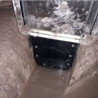 Close of vertical actuator blade on sewer flow regulator